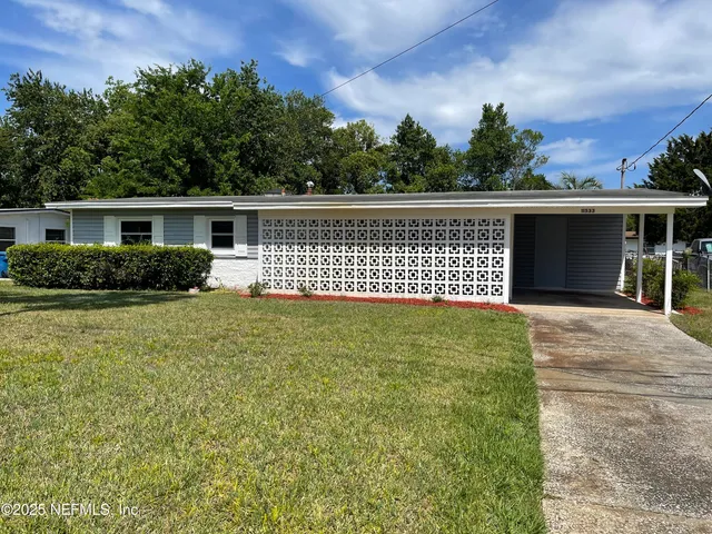 front view of a house with a yard