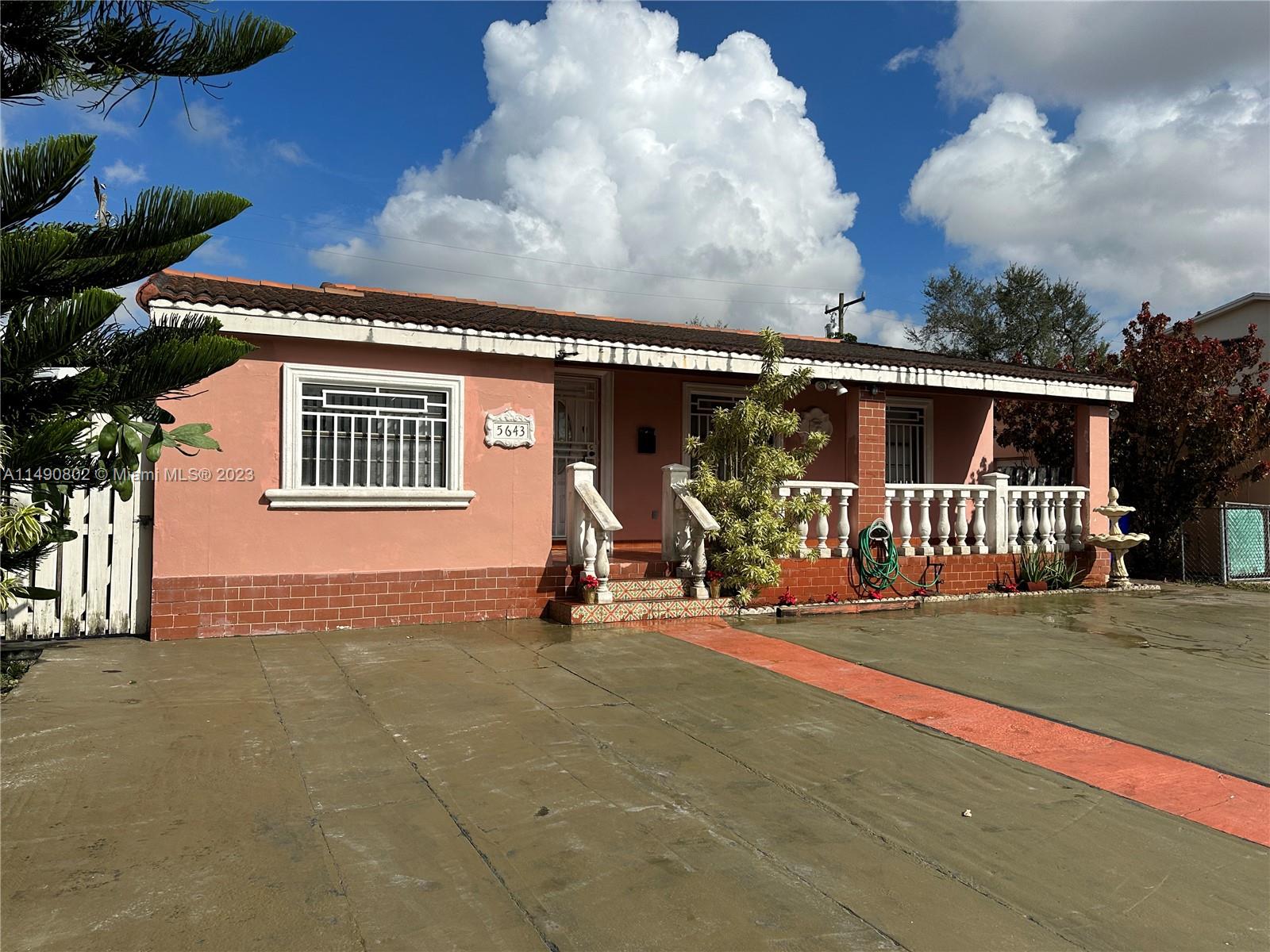 5643 Southwest 7th Street Miami, FL 33144 - Photo 1 of 25 front view of house with a yard