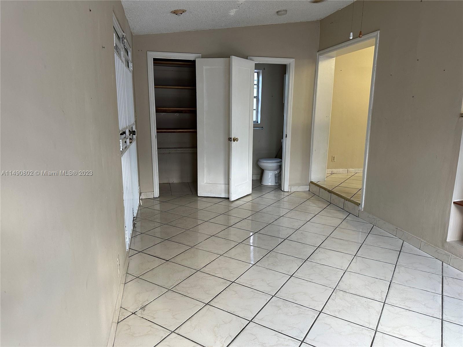 5643 Southwest 7th Street Miami, FL 33144 - Photo 11 of 25 an empty room with closet