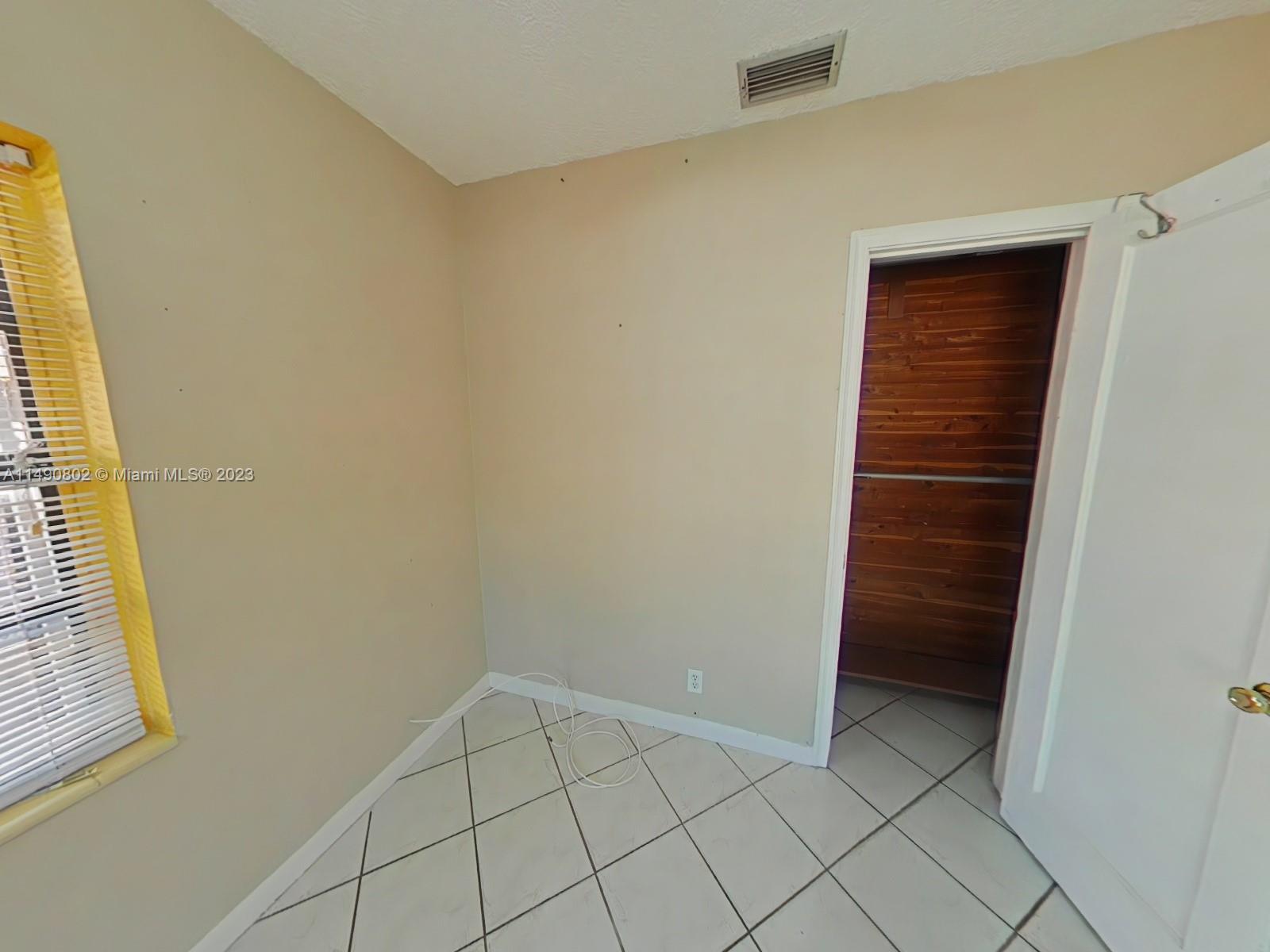 5643 Southwest 7th Street Miami, FL 33144 - Photo 15 of 25 a view of walk in closet with window
