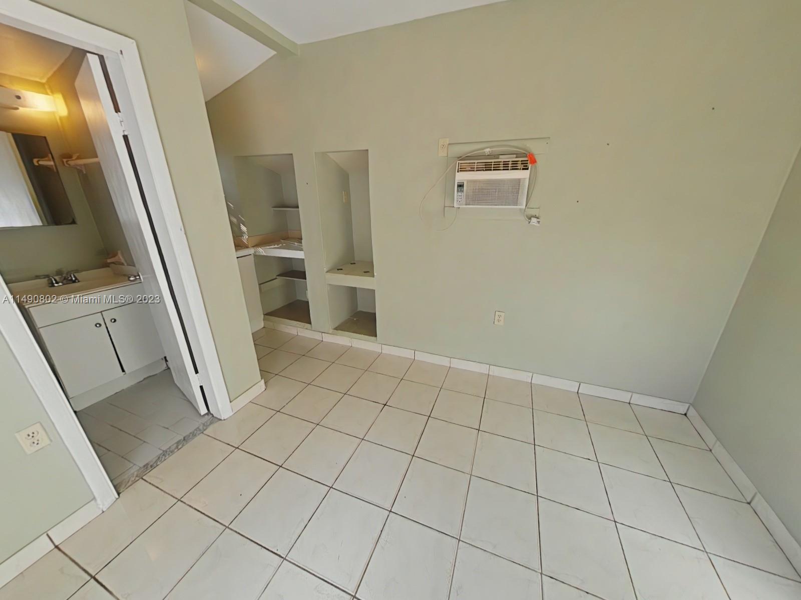 5643 Southwest 7th Street Miami, FL 33144 - Photo 21 of 25 view of an empty room and a bathroom