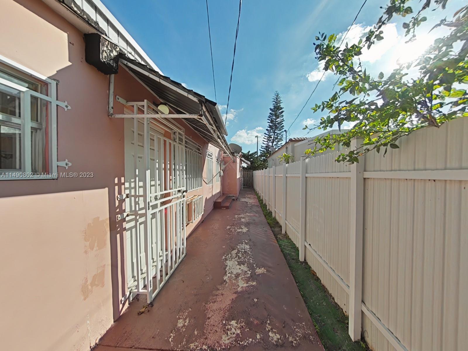 5643 Southwest 7th Street Miami, FL 33144 - Photo 24 of 25 a view of a house with wooden stairs