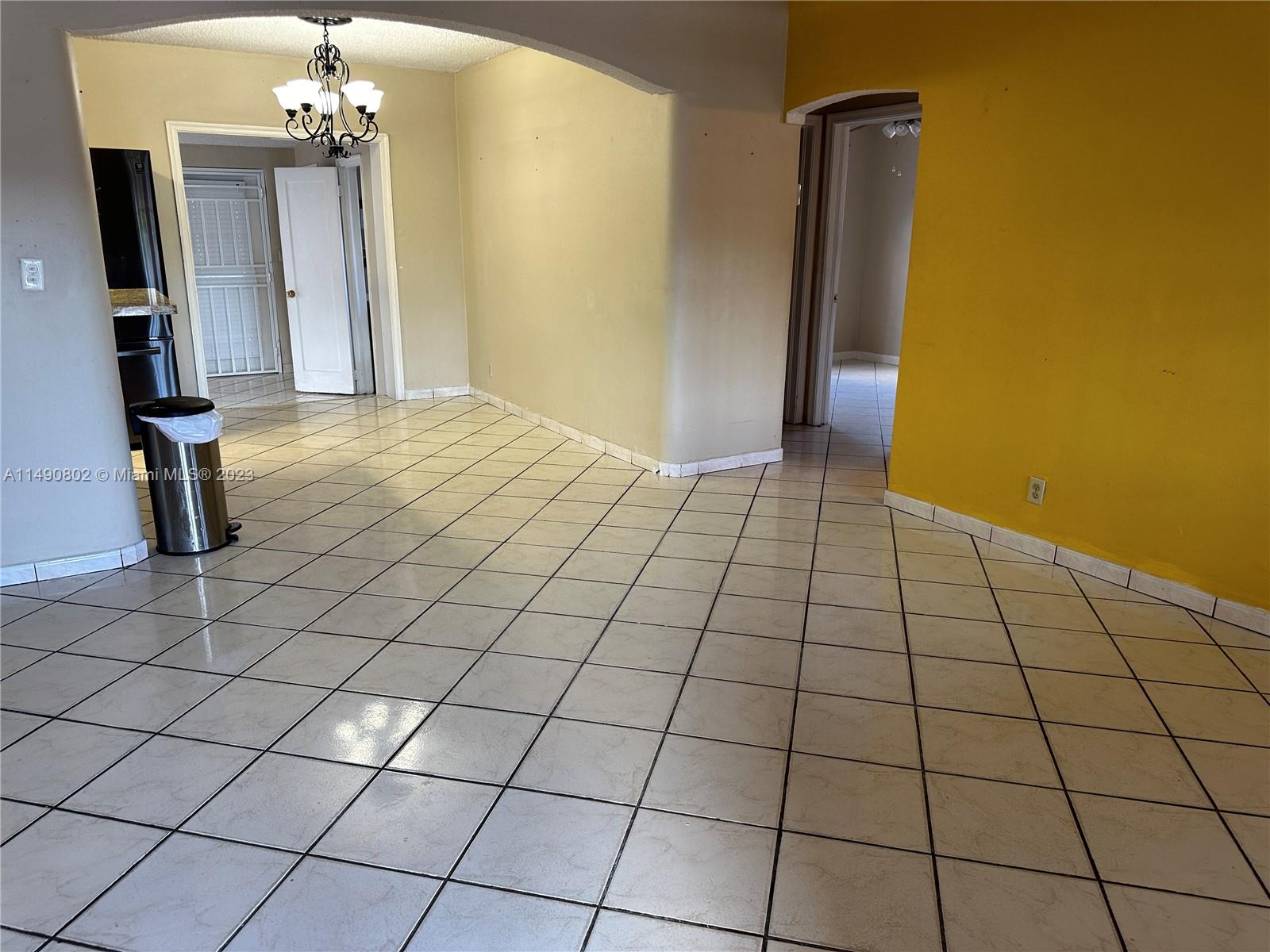 5643 Southwest 7th Street Miami, FL 33144 - Photo 4 of 25 a view of a livingroom with bathroom and window