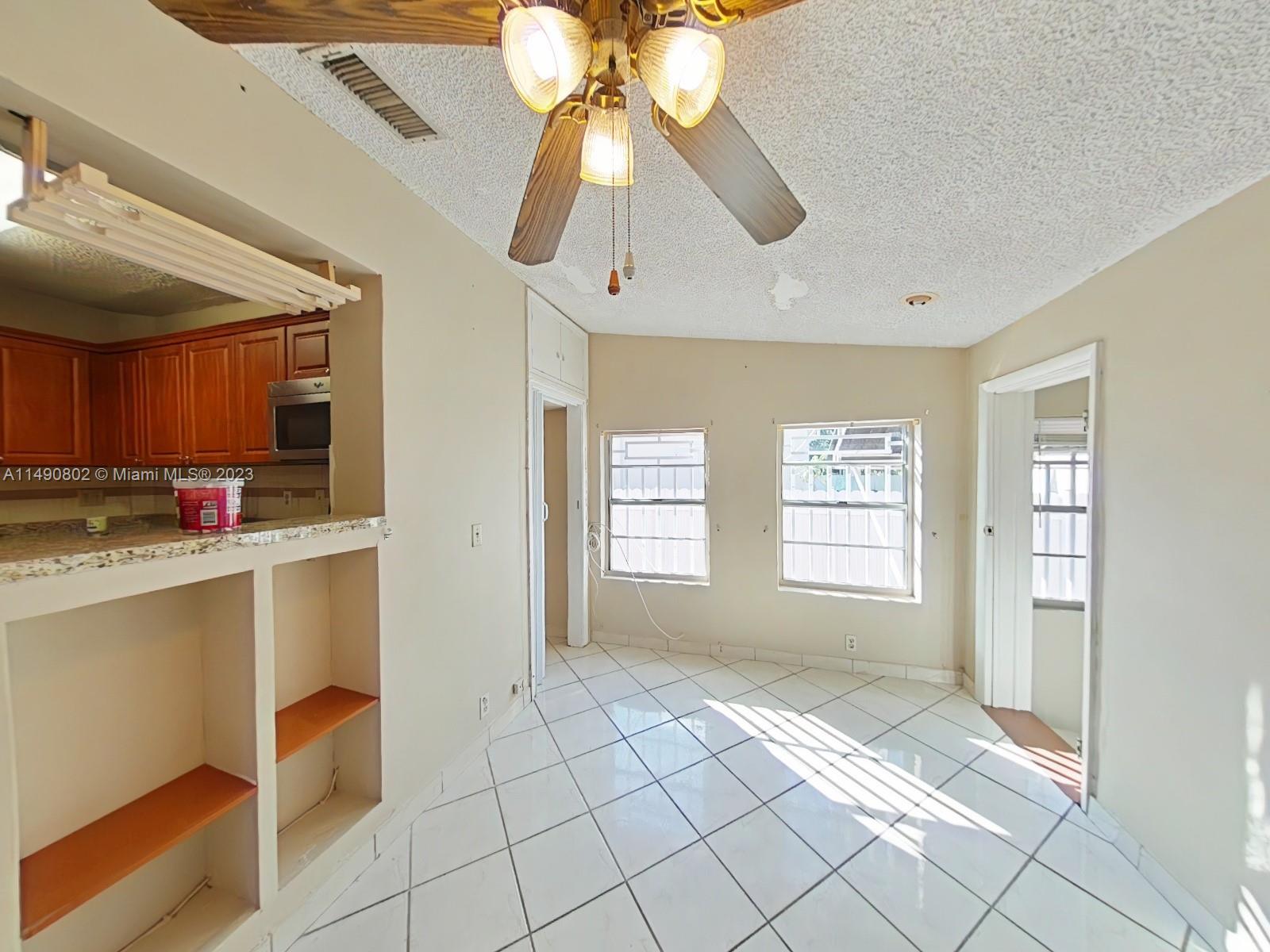 5643 Southwest 7th Street Miami, FL 33144 - Photo 6 of 25 a view of kitchen and window
