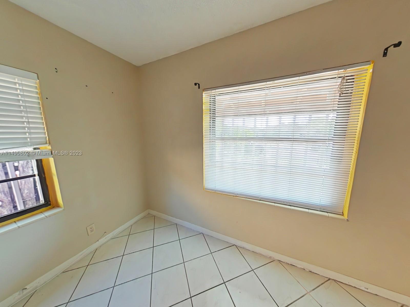 5643 Southwest 7th Street Miami, FL 33144 - Photo 7 of 25 a view of an empty room with a window