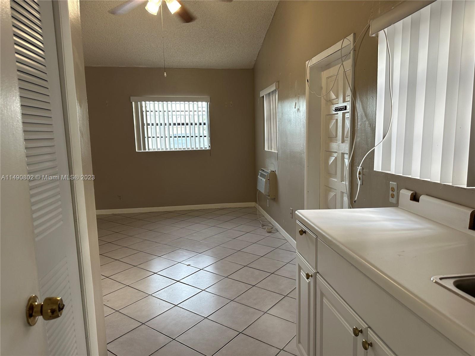 5643 Southwest 7th Street Miami, FL 33144 - Photo 10 of 25 a bathroom with a sink and a mirror