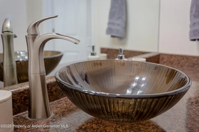 a table with a sink and wooden floor
