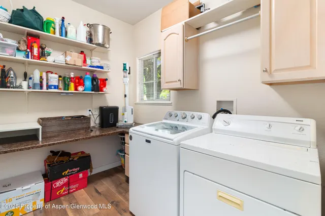 a view of storage and utility room with washer and dryer
