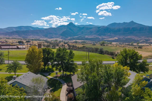 a view of a city with mountains in the background