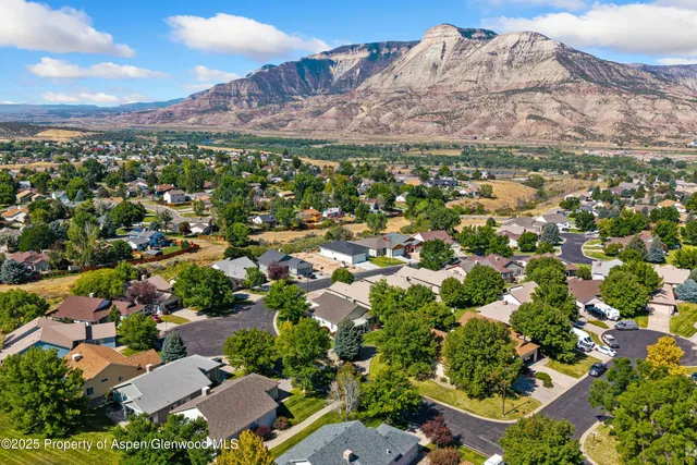 a view of a city with mountains in the background