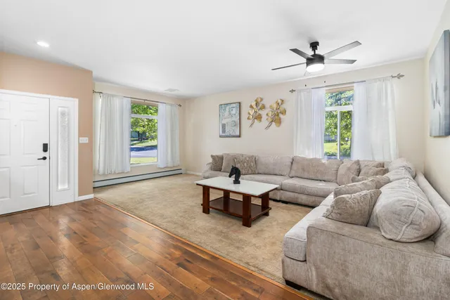 a living room with furniture and a window