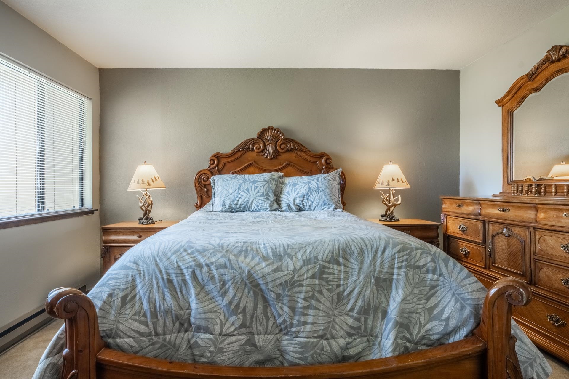 94 John Muir Road, Unit 132 Mammoth Lakes, CA 93546 - Photo 24 of 58 a bedroom with a bed and wooden floor