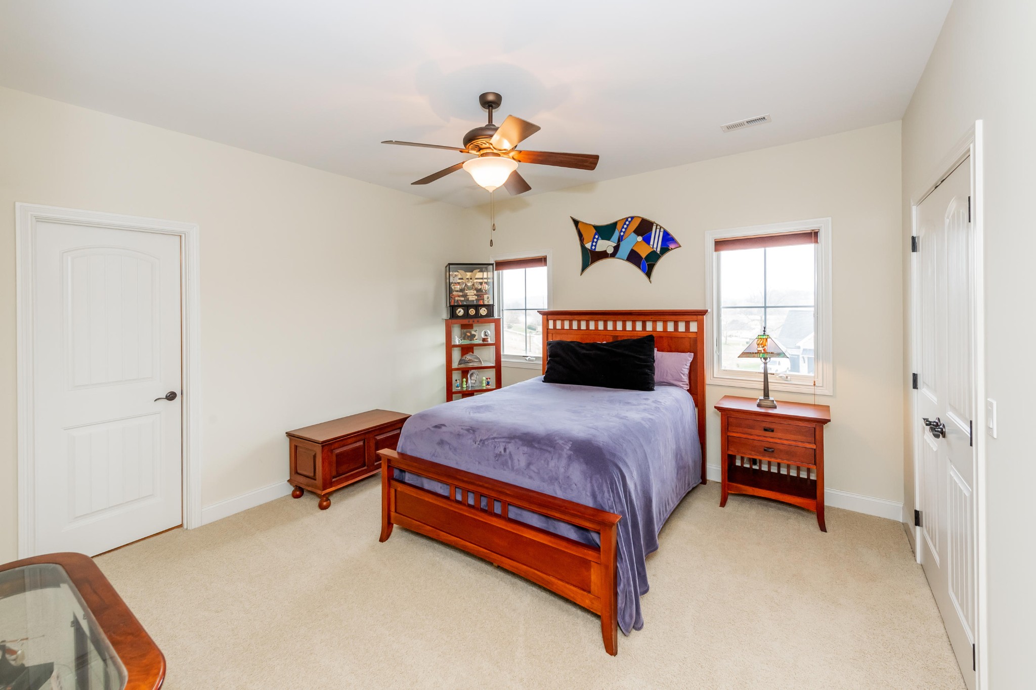 1340 Persimmon Road Loudon, TN 37774 - Photo 30 of 39 a bedroom with a bed and a chandelier