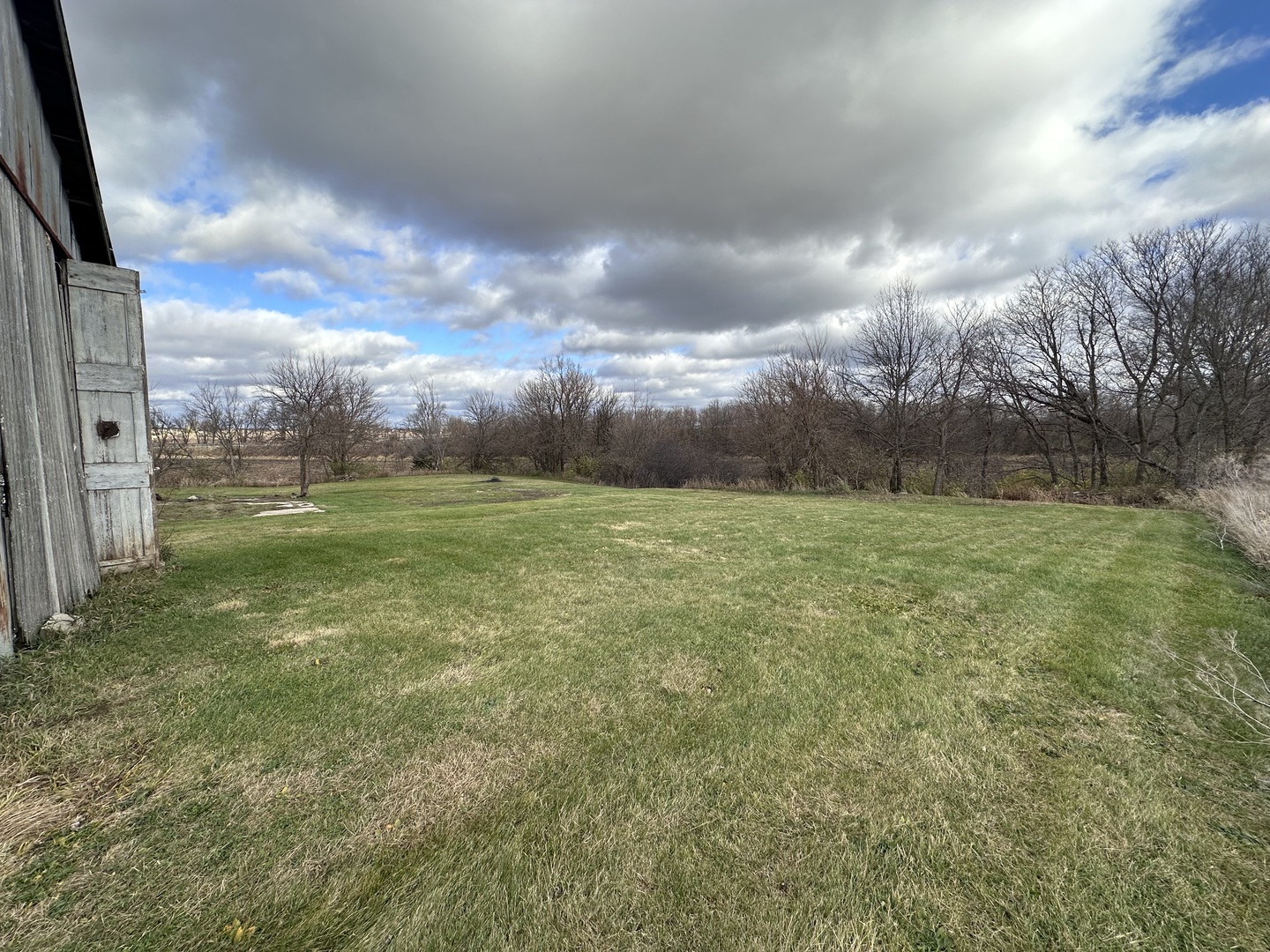 14050 Agnew Road Sterling, IL 61081 - Photo 11 of 27 a view of a big yard with a fountain