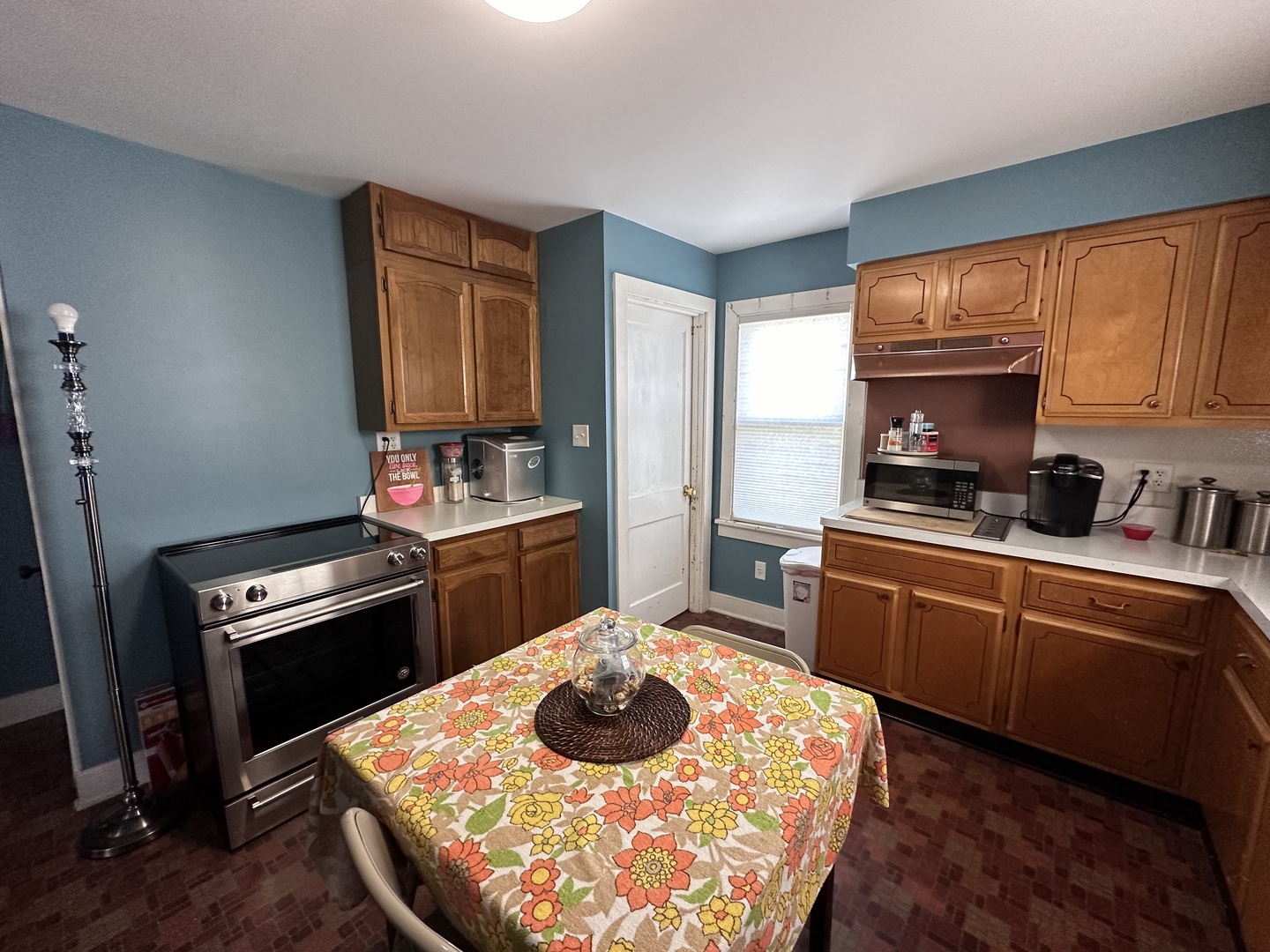14050 Agnew Road Sterling, IL 61081 - Photo 15 of 27 a kitchen with a stove a sink and a refrigerator