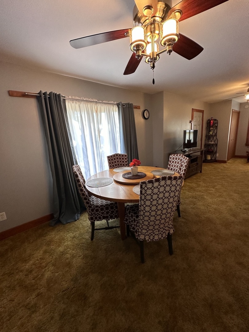 14050 Agnew Road Sterling, IL 61081 - Photo 17 of 27 a room with furniture and window