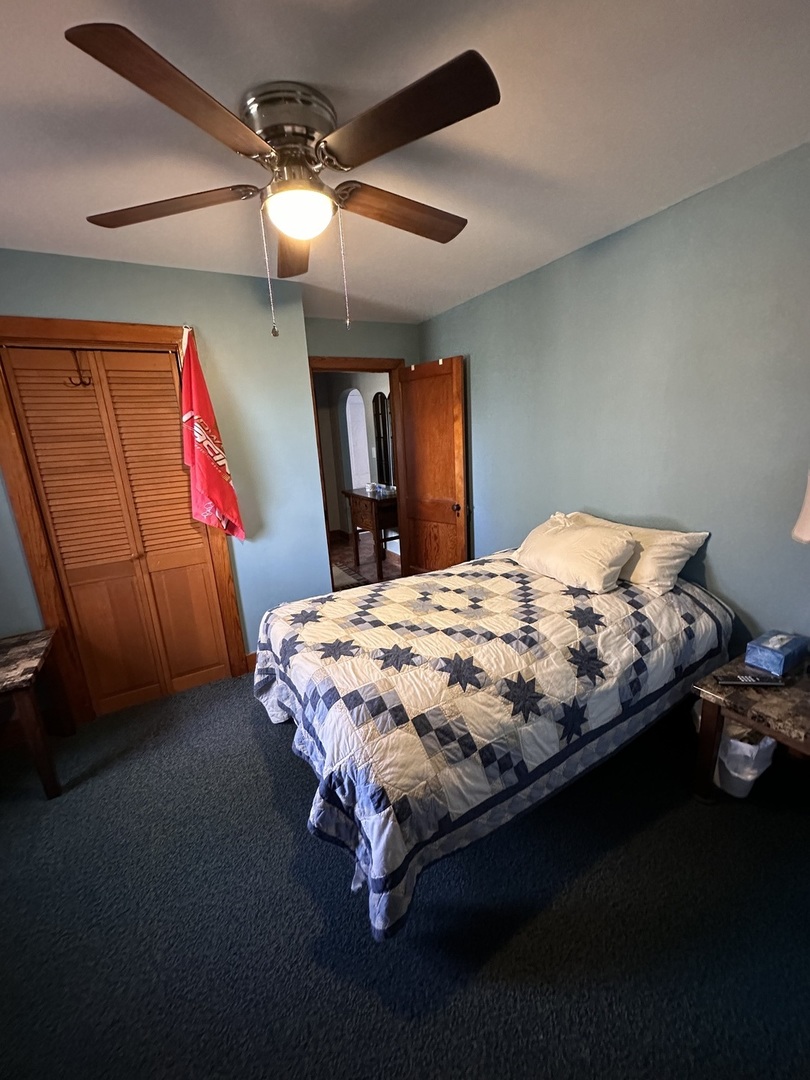 14050 Agnew Road Sterling, IL 61081 - Photo 20 of 27 a bed sitting in a room next to a window
