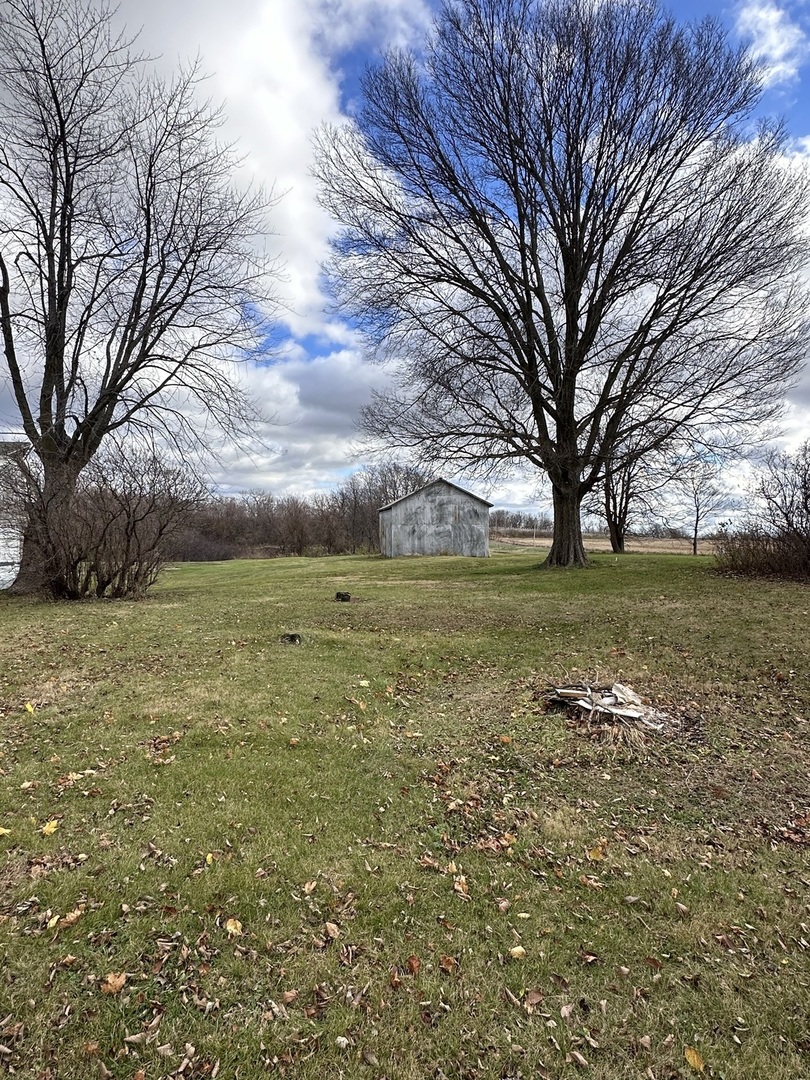 14050 Agnew Road Sterling, IL 61081 - Photo 9 of 27 a view of a field with an trees