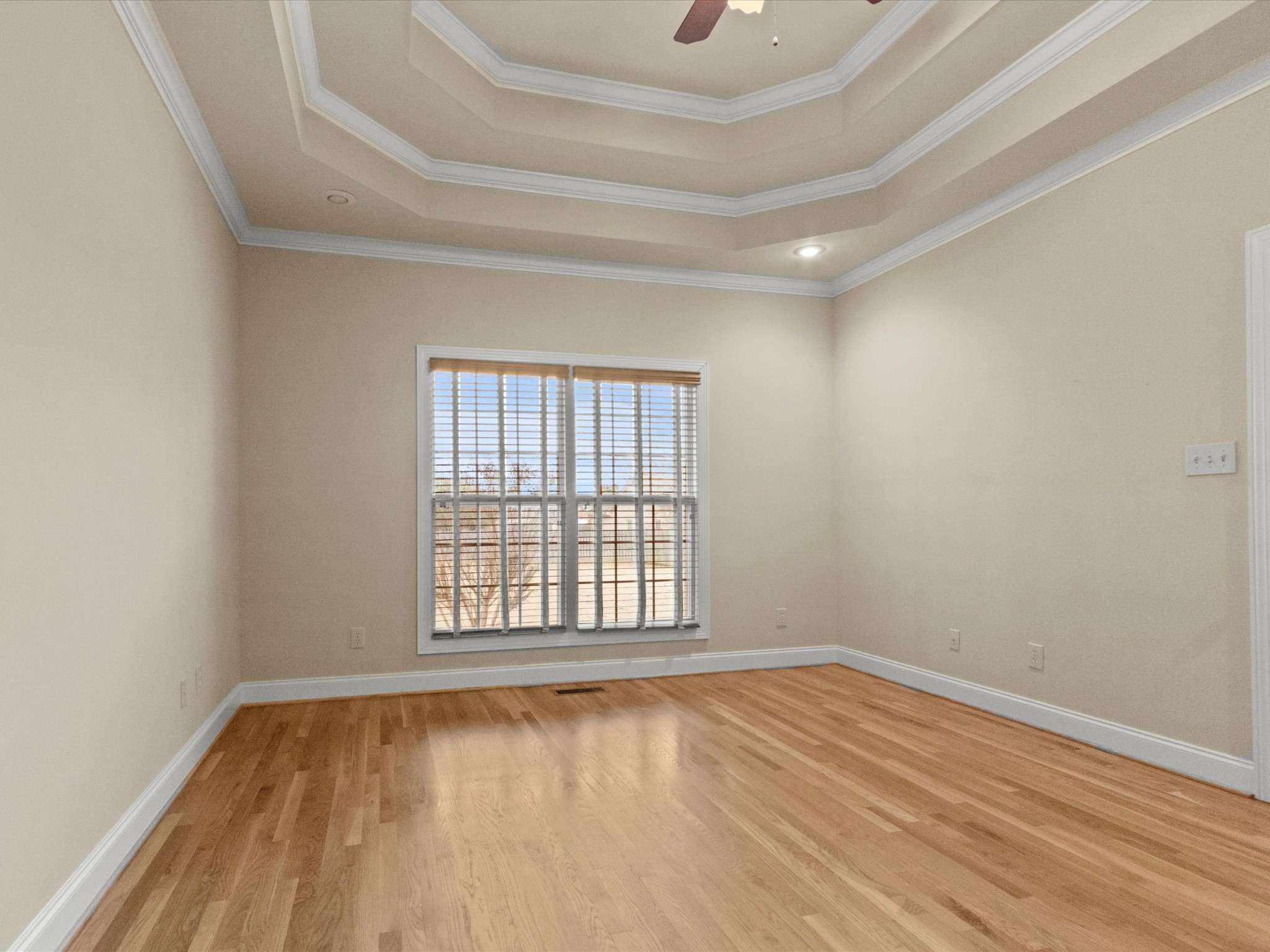 715 South Clinton Street Athens, AL 35611 - Photo 12 of 63 an empty room with wooden floor and windows