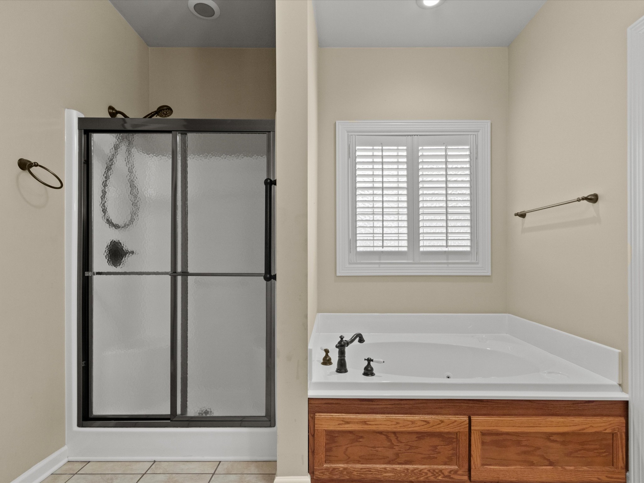 715 South Clinton Street Athens, AL 35611 - Photo 15 of 63 a bathroom with a bathtub and a shower
