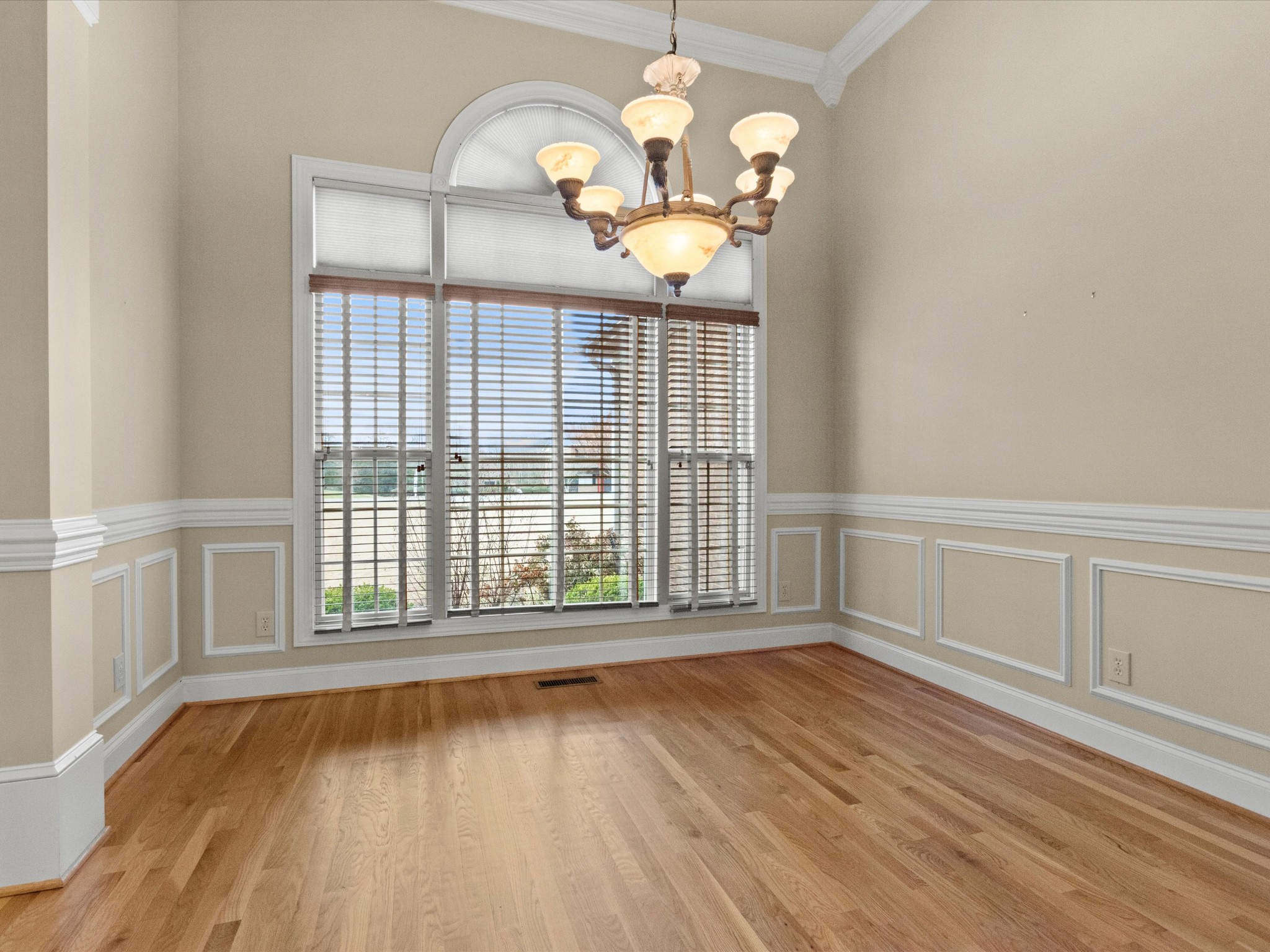 715 South Clinton Street Athens, AL 35611 - Photo 17 of 63 a view of an empty room with wooden floor and a window