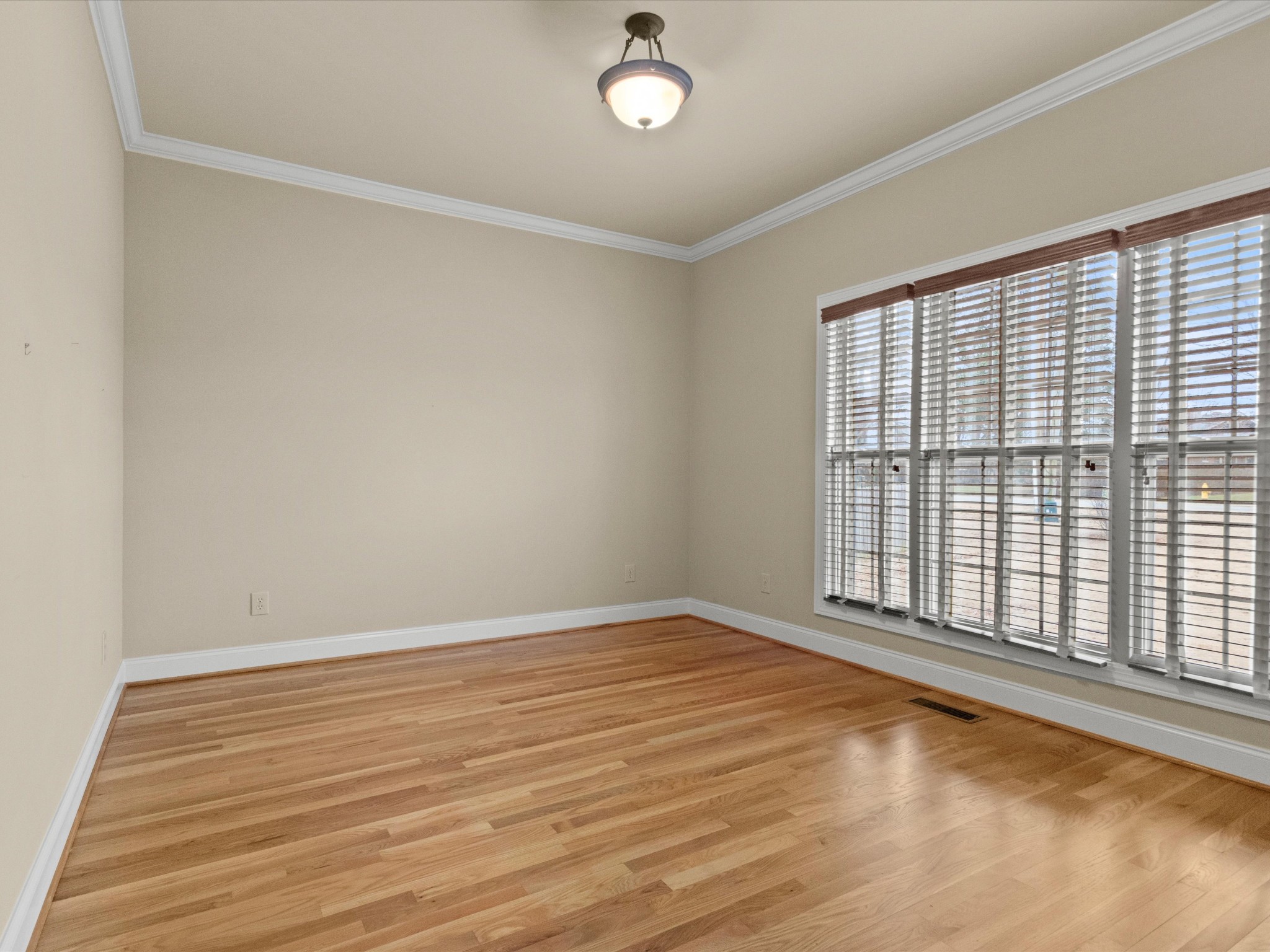 715 South Clinton Street Athens, AL 35611 - Photo 18 of 63 wooden floor in an empty room with a window