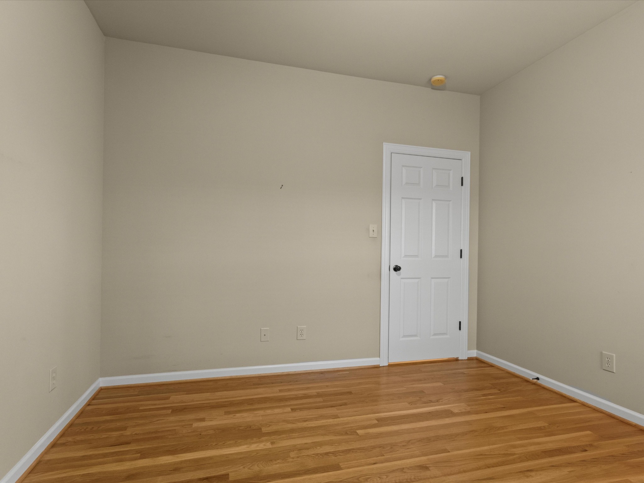 715 South Clinton Street Athens, AL 35611 - Photo 21 of 63 a view of an empty room with wooden floor and closet