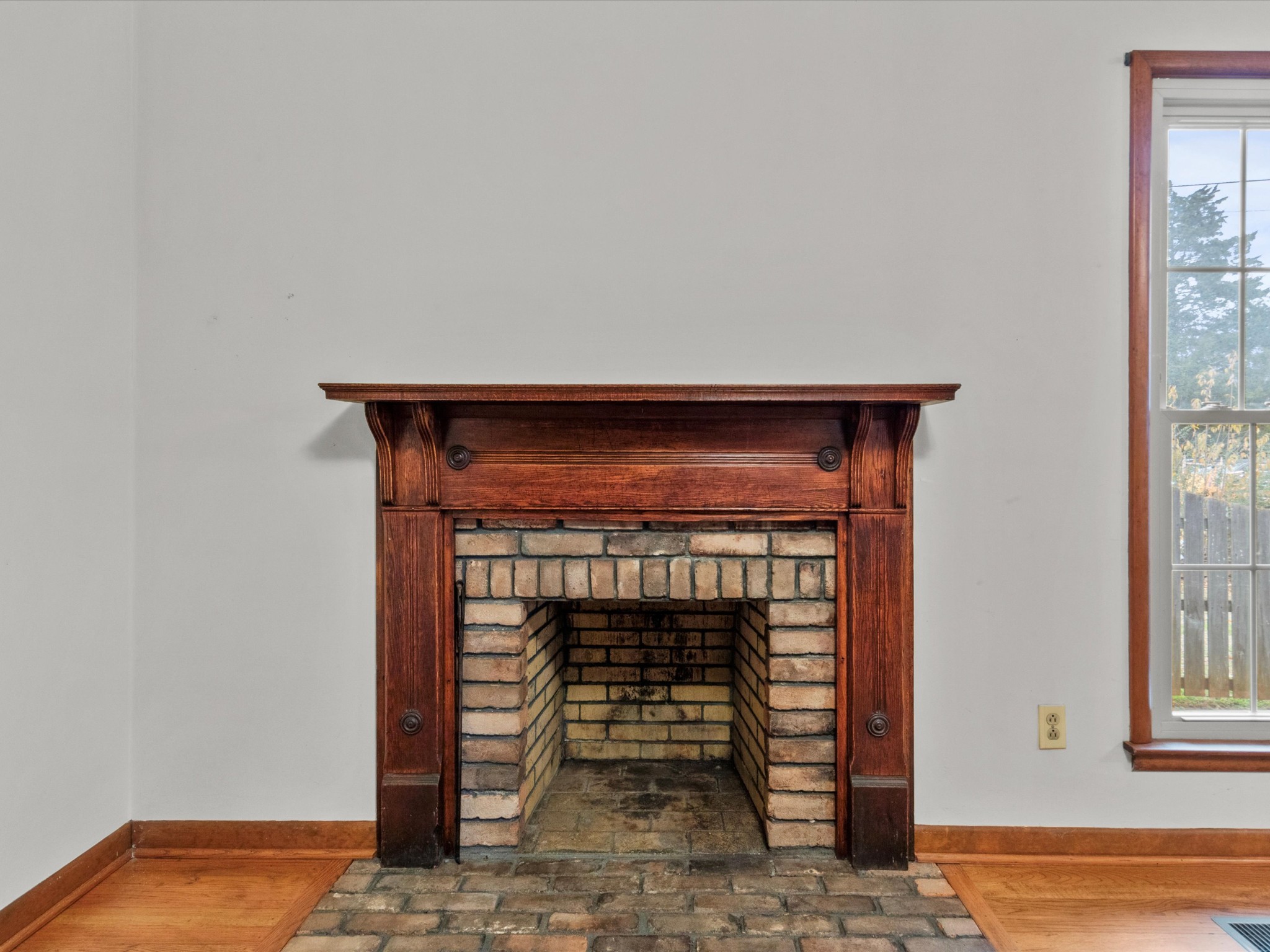 715 South Clinton Street Athens, AL 35611 - Photo 40 of 63 a room with a fireplace and a window