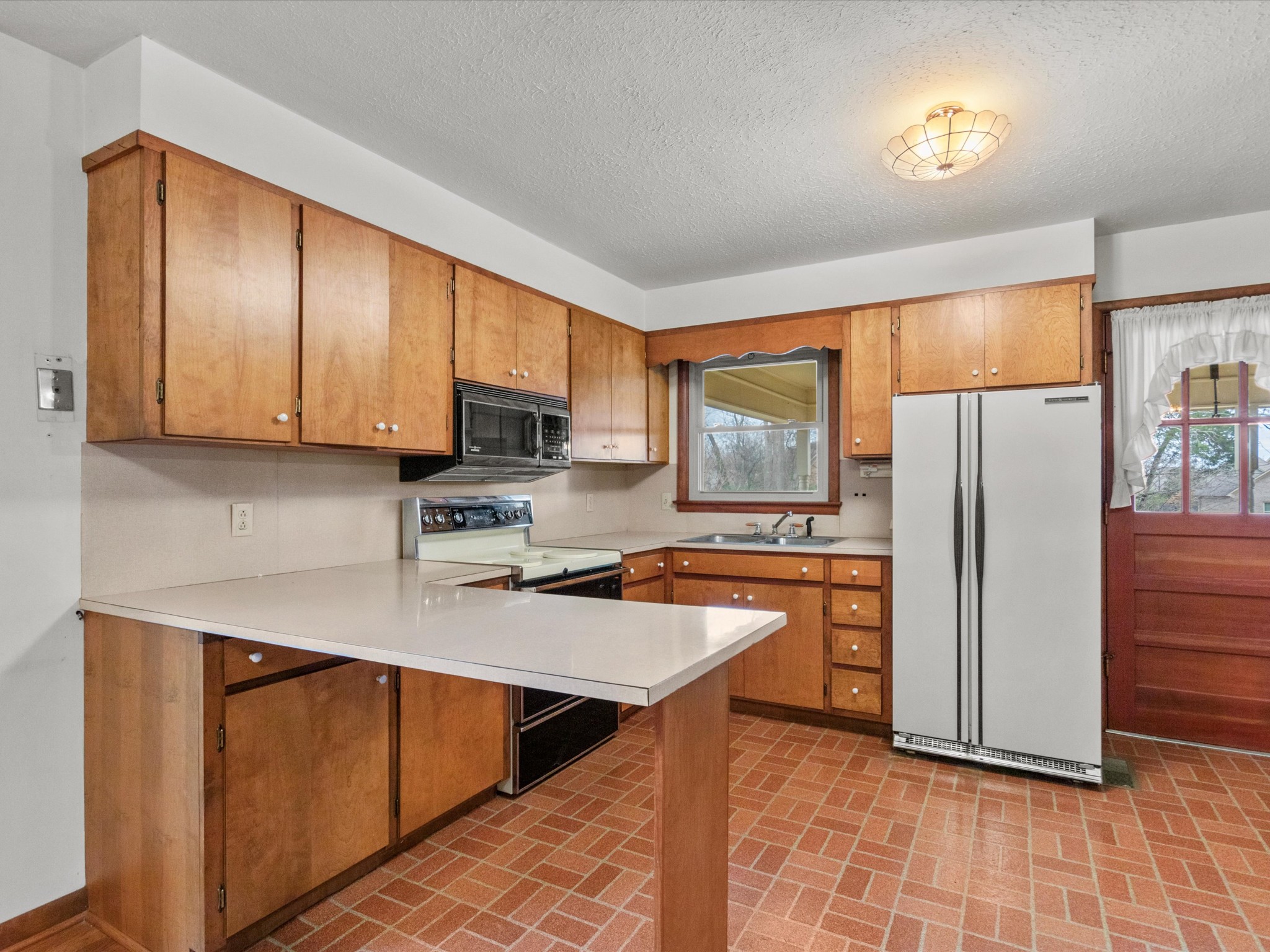 715 South Clinton Street Athens, AL 35611 - Photo 43 of 63 a kitchen with stainless steel appliances granite countertop a refrigerator stove top oven and sink