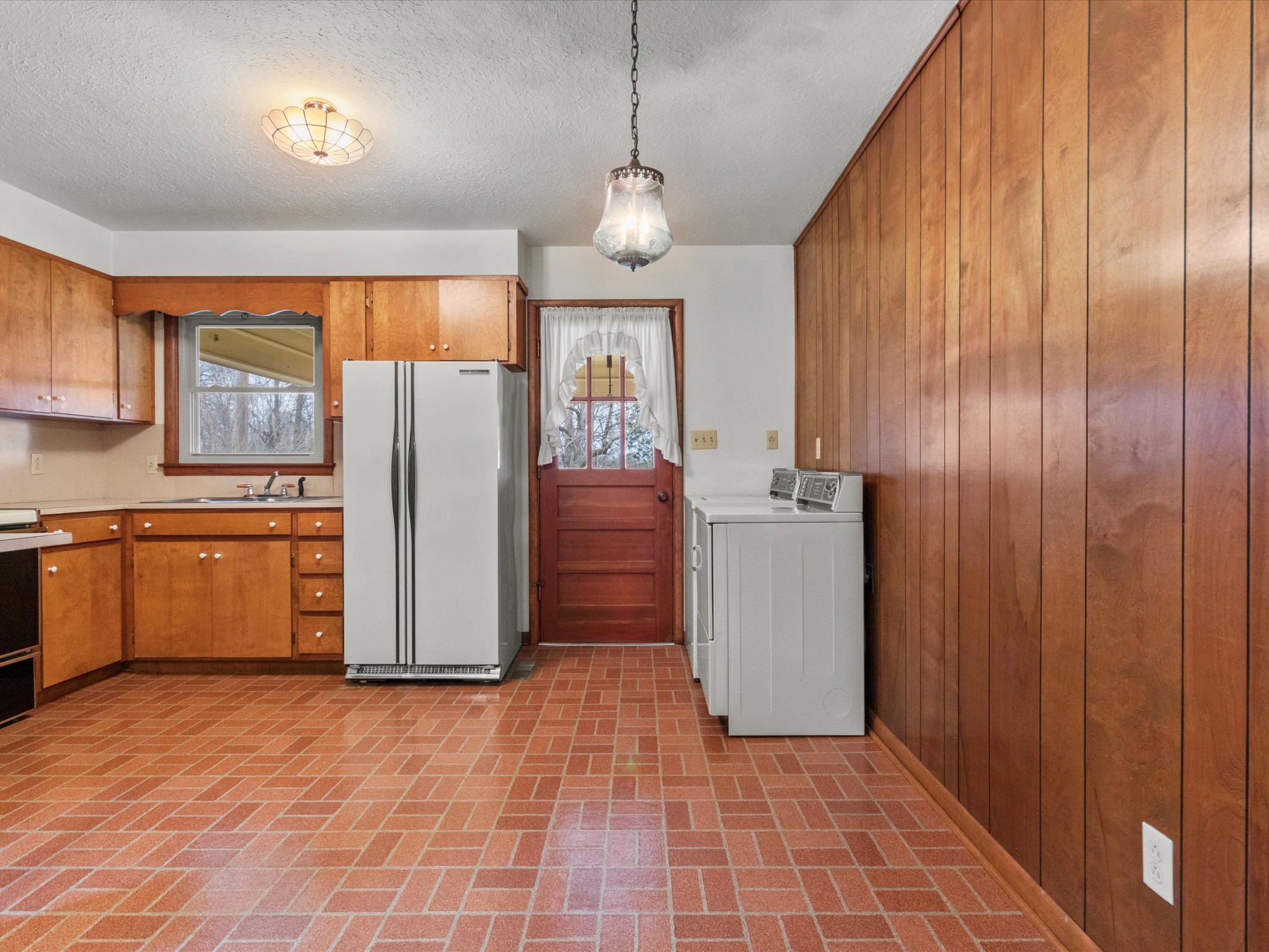 715 South Clinton Street Athens, AL 35611 - Photo 44 of 63 a kitchen with refrigerator and cabinets