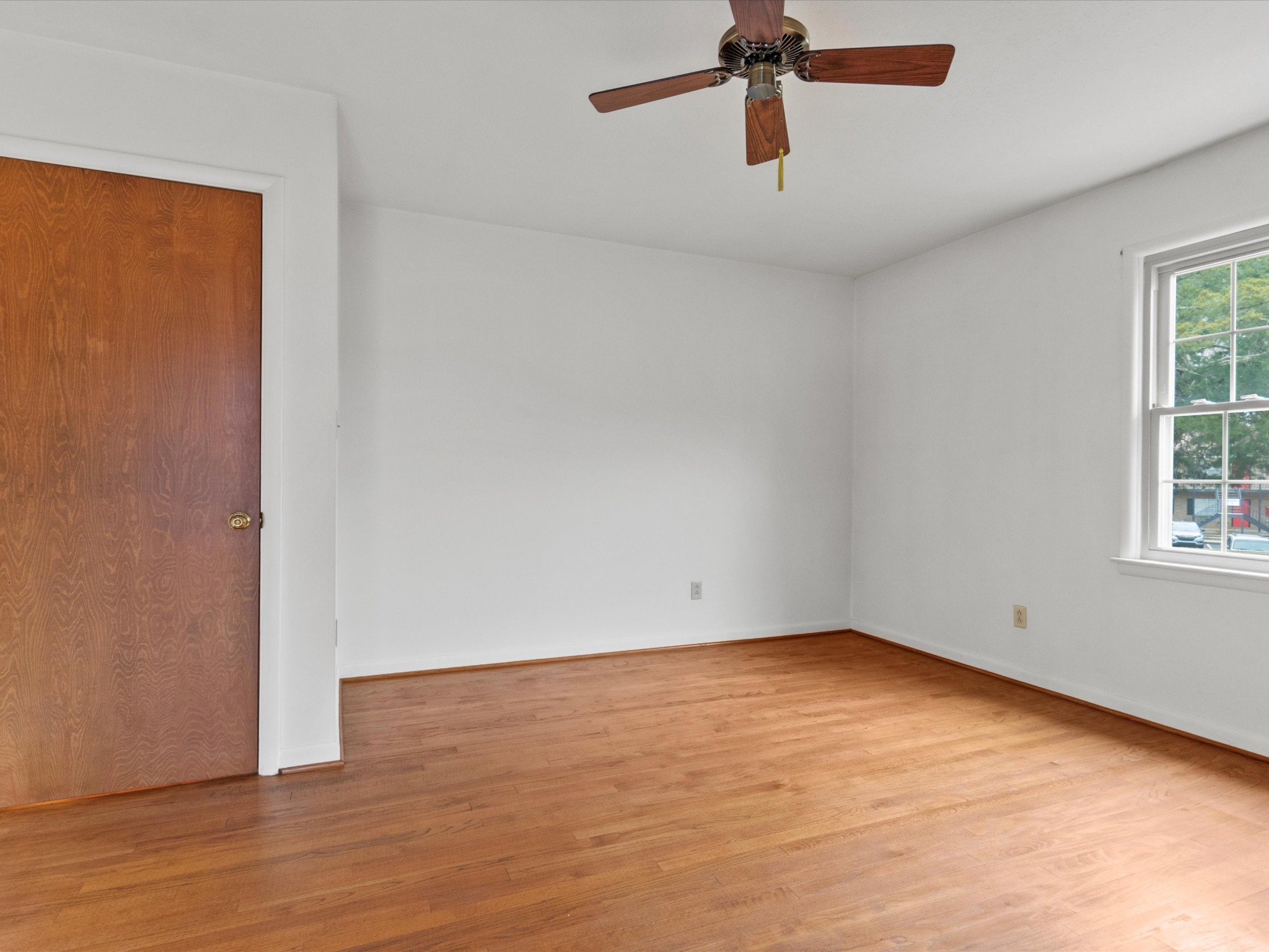 715 South Clinton Street Athens, AL 35611 - Photo 49 of 63 wooden floor in an empty room with a window