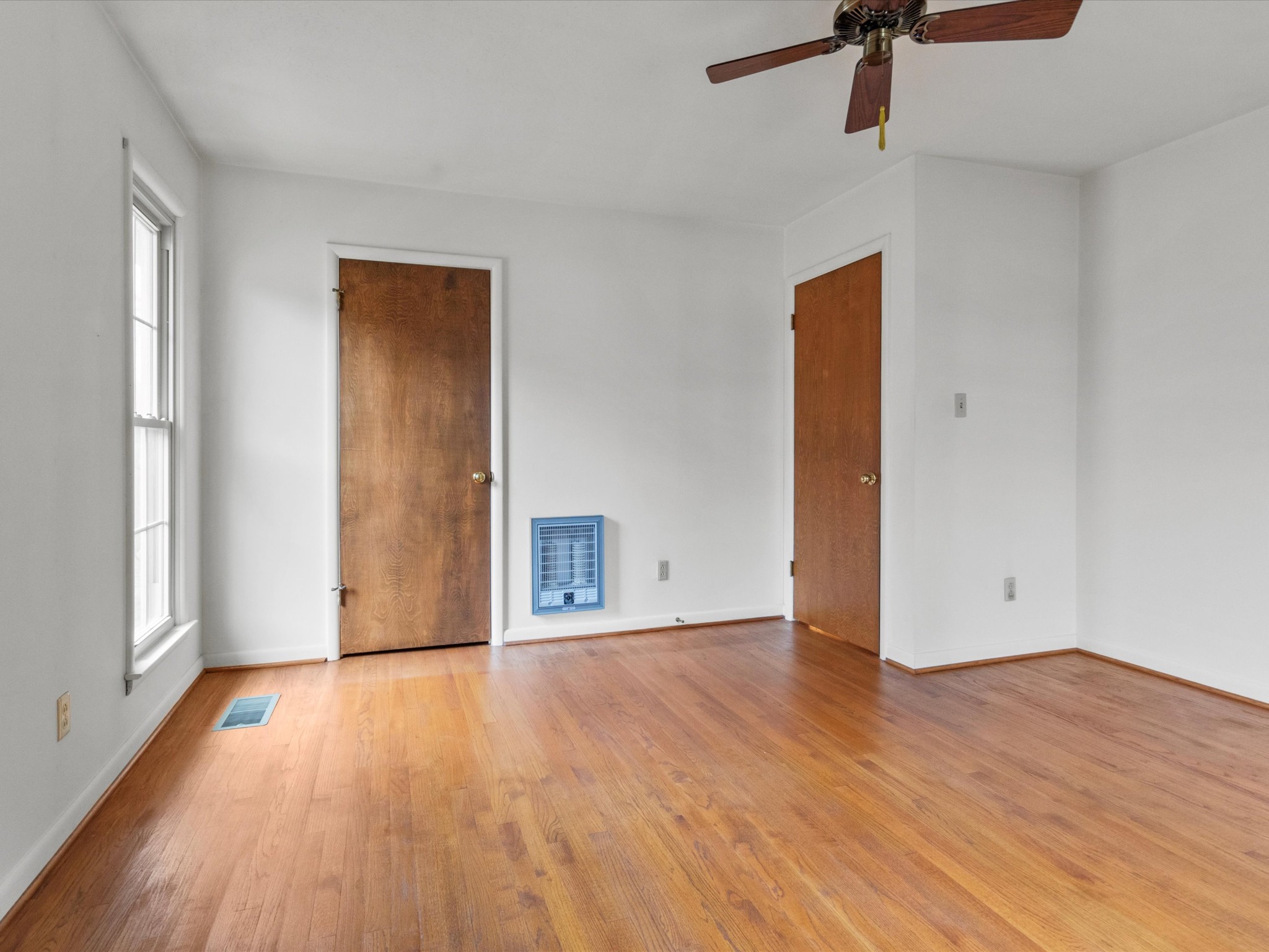 715 South Clinton Street Athens, AL 35611 - Photo 50 of 63 a view of an empty room with wooden floor and a window
