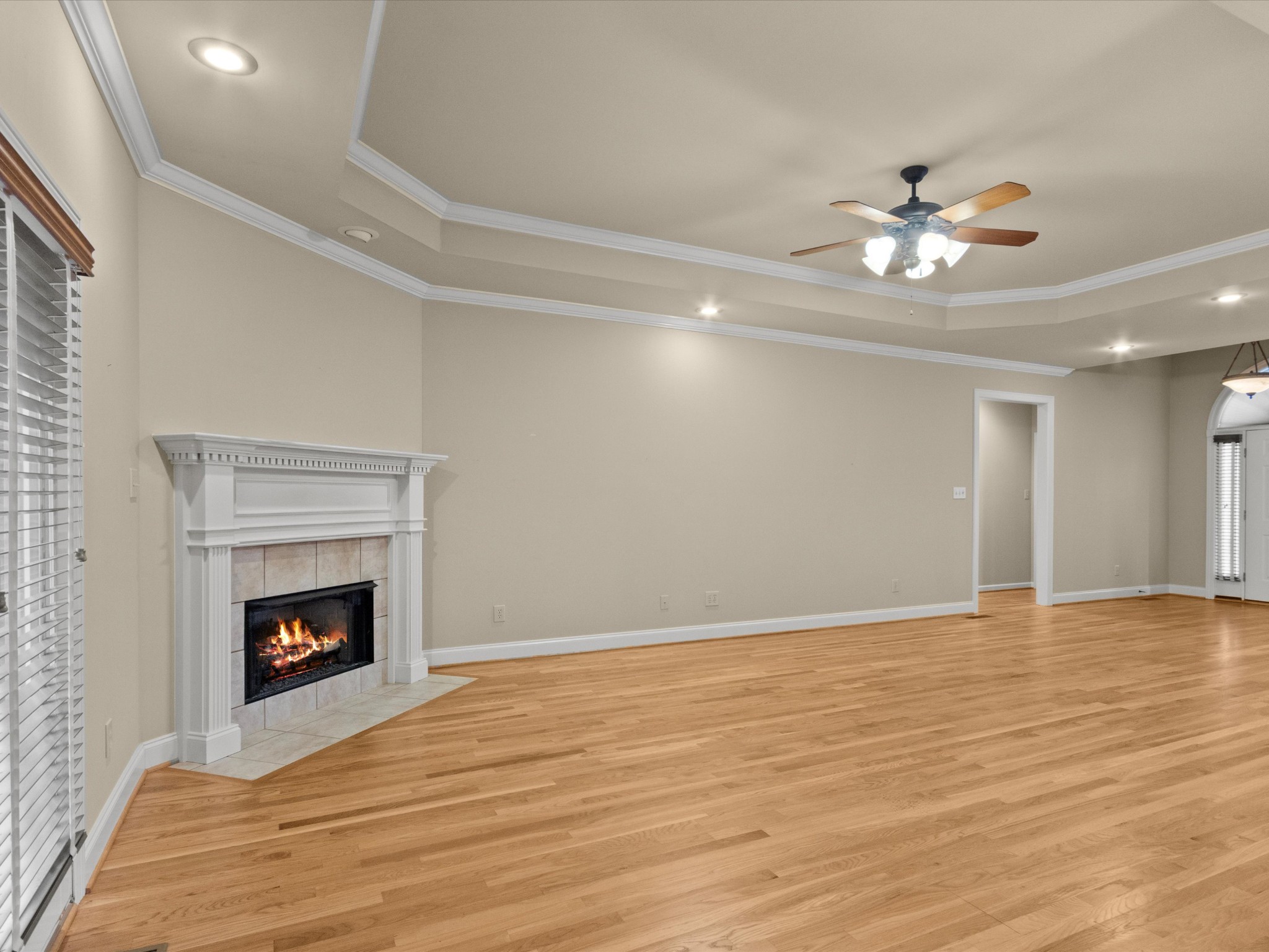 715 South Clinton Street Athens, AL 35611 - Photo 5 of 63 a view of an empty room with wooden floor fireplace and a window