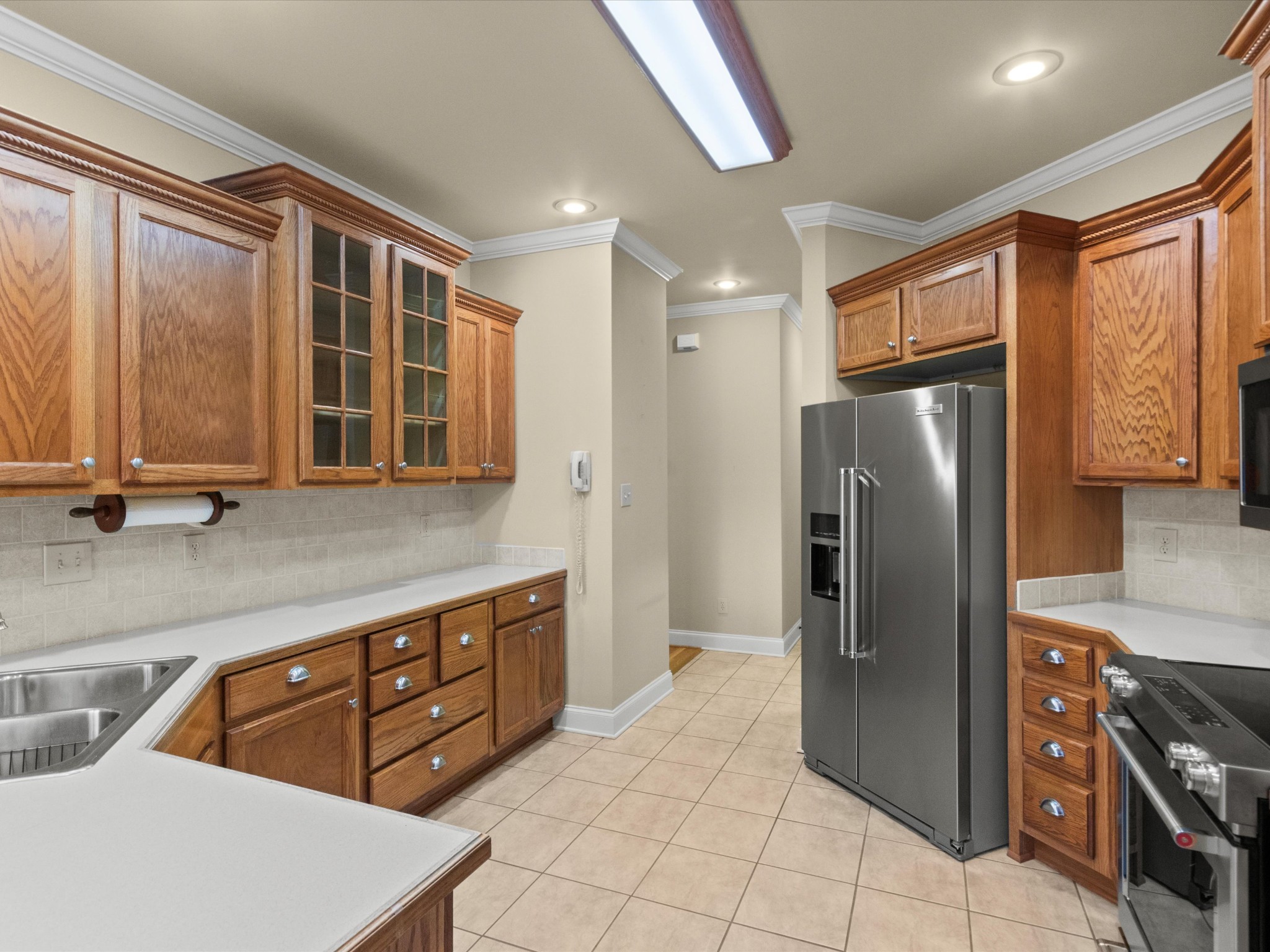 715 South Clinton Street Athens, AL 35611 - Photo 9 of 63 a kitchen with stainless steel appliances granite countertop a refrigerator and a sink
