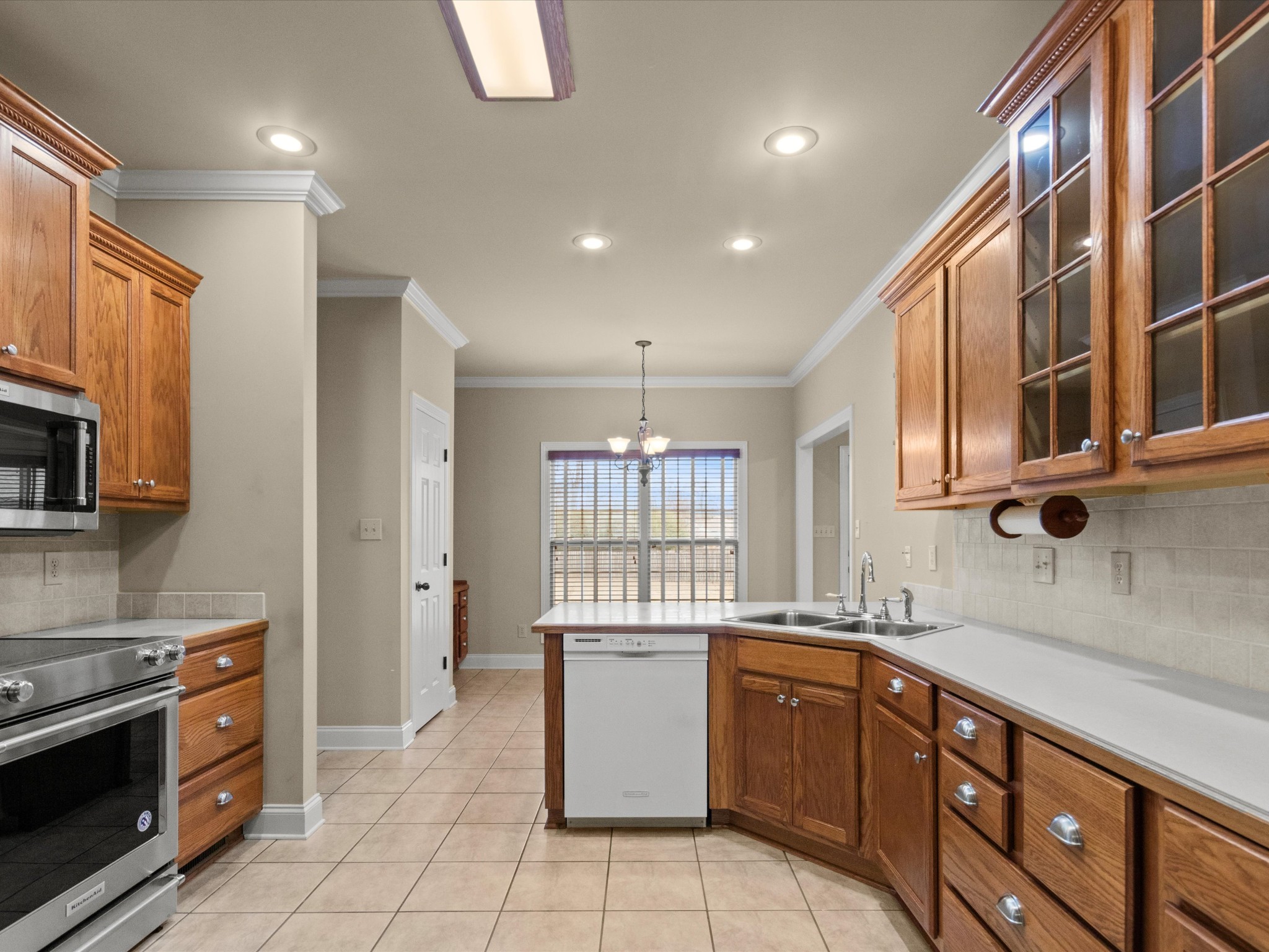 715 South Clinton Street Athens, AL 35611 - Photo 10 of 63 a kitchen with stainless steel appliances granite countertop a stove and a sink