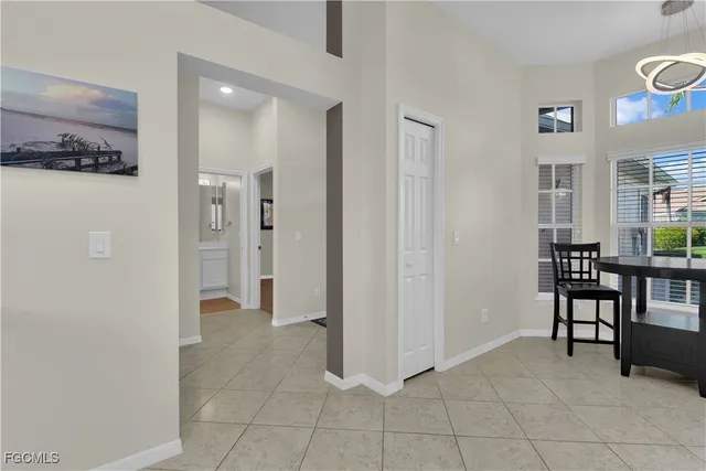 a living room with furniture and a ceiling fan
