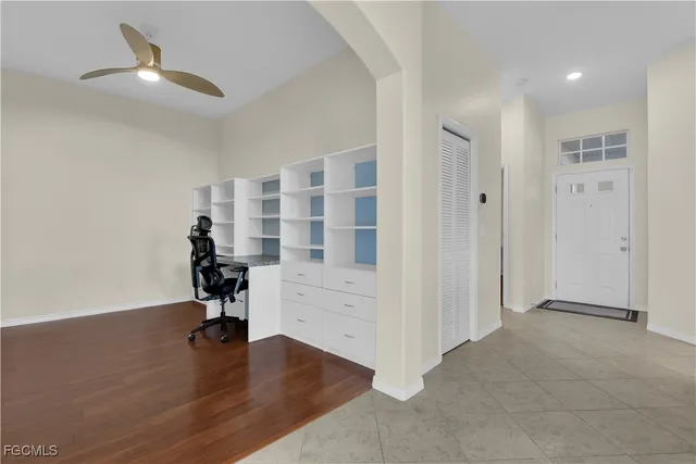 a bedroom with a large bed and a large window