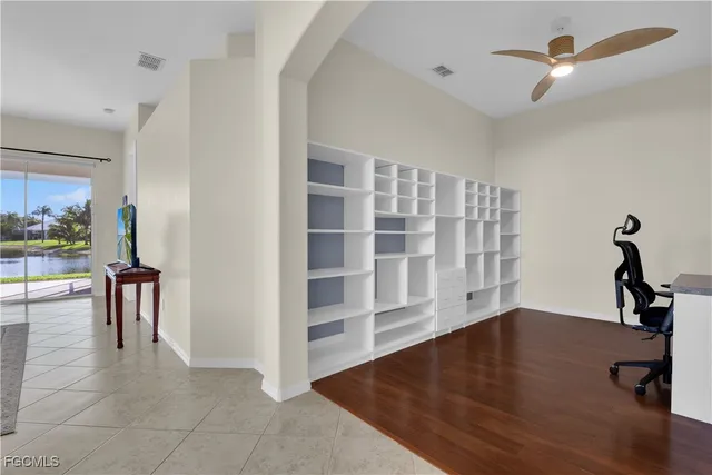 a bed room with a bed and a night stand