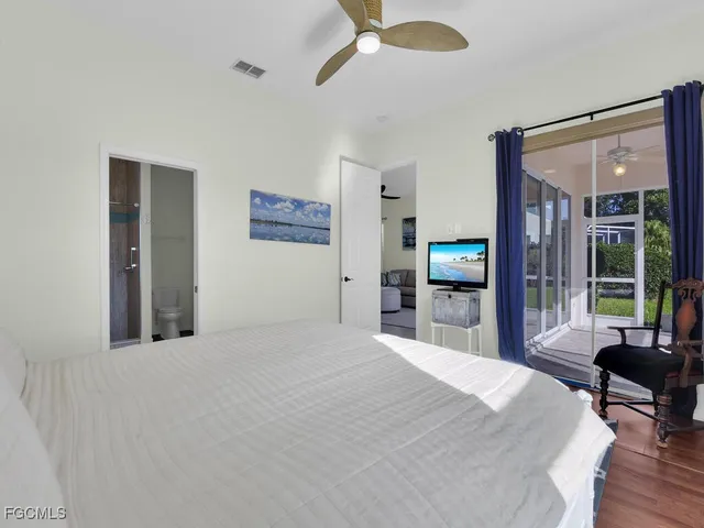 a view of a house with a yard and a patio