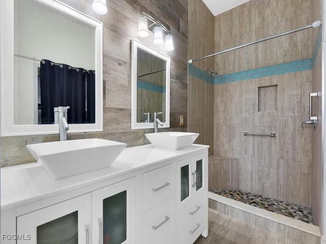 a view of a lake with houses in the back