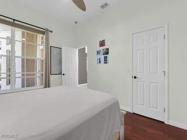 a view of a lake with houses in the back