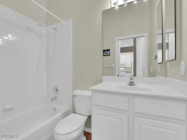 an aerial view of a house with a swimming pool outdoor seating and yard