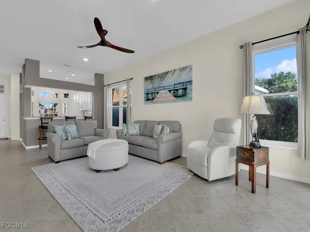 a view of dining room and kitchen with a table chairs
