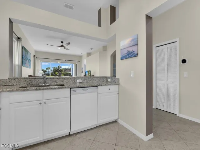 a view of a walk in closet with wooden floor