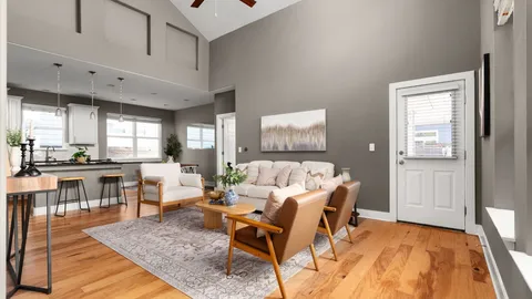 a living room with furniture and a rug