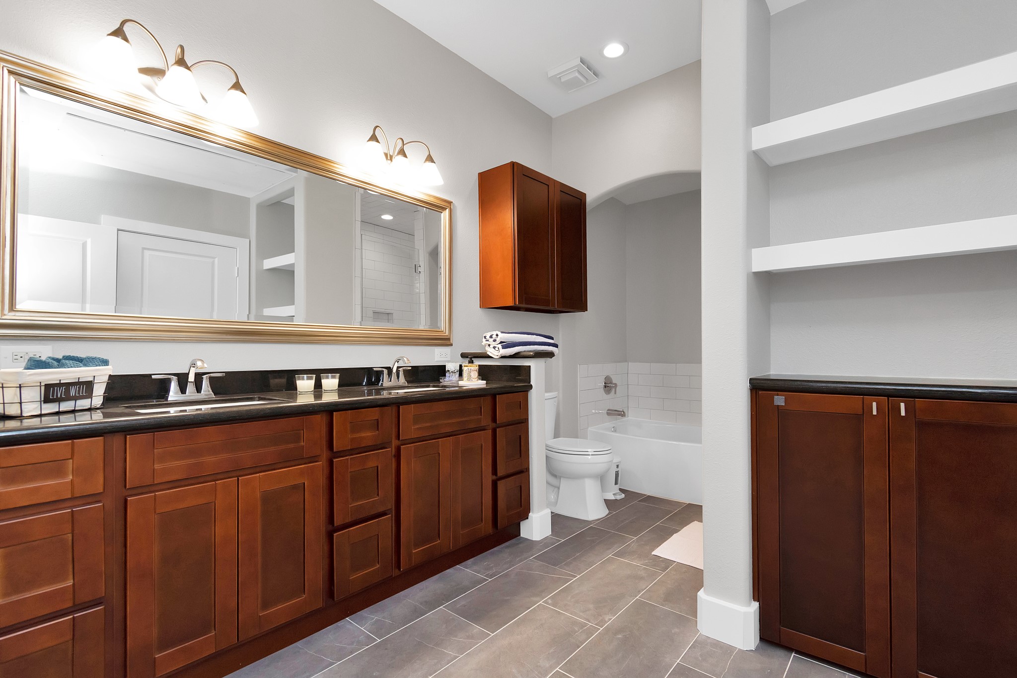 1901 Post Oak Boulevard, Unit 3113 Houston, TX 77056 - Photo 19 of 34 Cleanliness and organization were considered in this bathroom in addition to style. The bathroom is fitted with plenty of storage for both your bath products and also easy access to towels and linens.