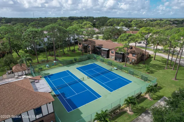 a view of porch with a table and chairs