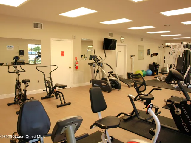 a kitchen with a sink a stove and cabinets