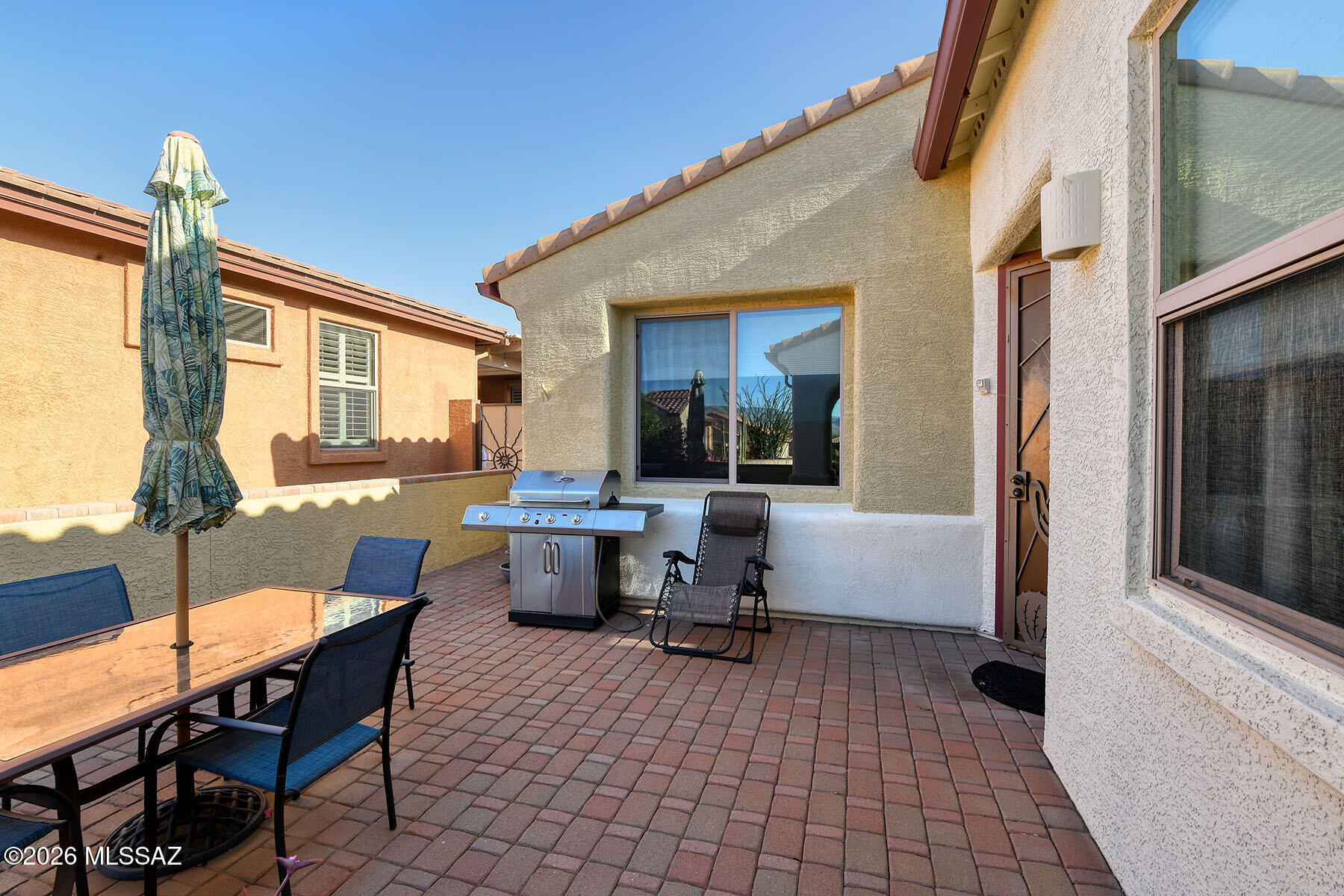 13991 East Cheavront Loop Vail, AZ 85641 - Photo 38 of 47 a view of a patio with a dining table and chairs