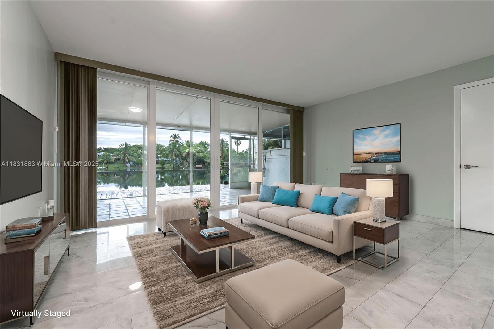 a living room with furniture and large window